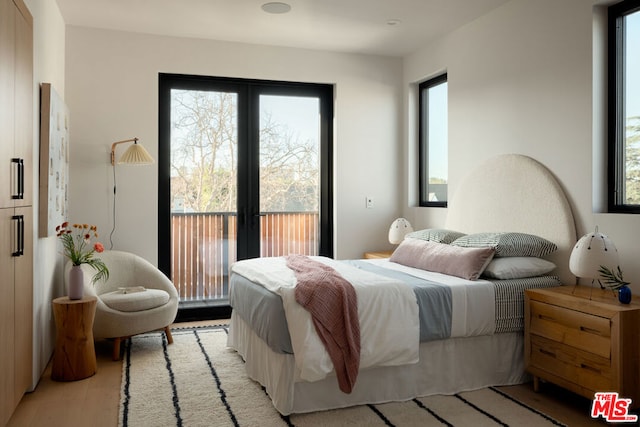 bedroom with access to outside and french doors