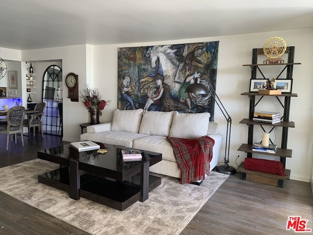 living room featuring dark wood-type flooring