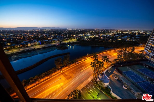 aerial view at dusk with a water view