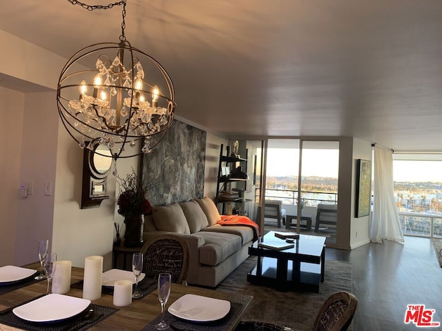 dining room with dark hardwood / wood-style floors, floor to ceiling windows, and a chandelier