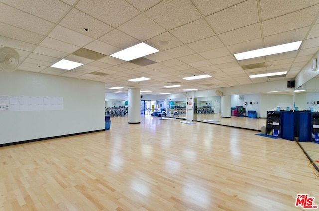 exercise area with light hardwood / wood-style floors