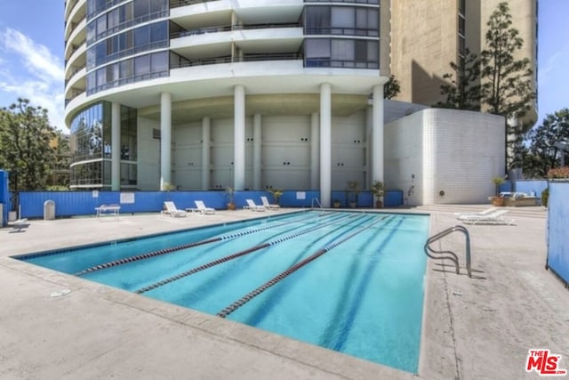 view of pool featuring a patio