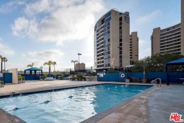 view of swimming pool featuring a patio