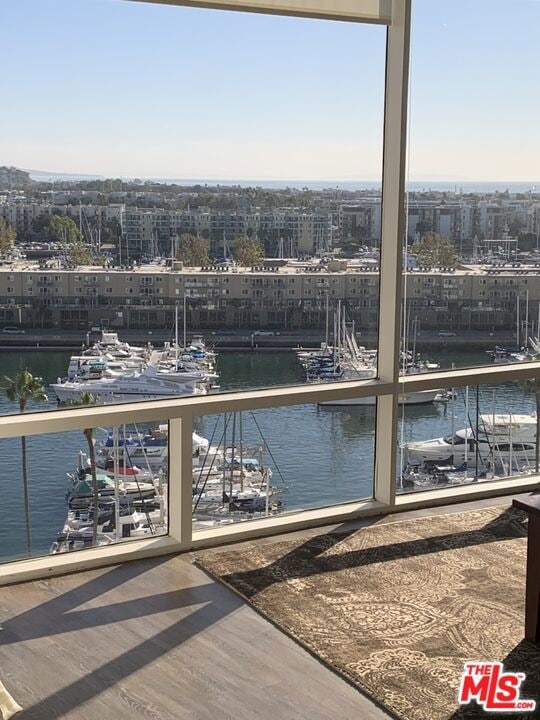 exterior space with a balcony and a water view