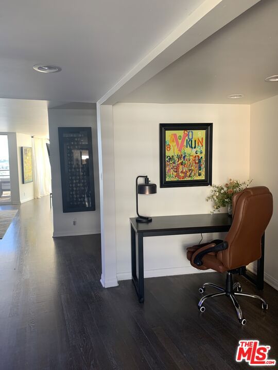 office space with dark hardwood / wood-style floors