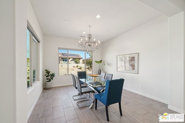 dining space with a notable chandelier