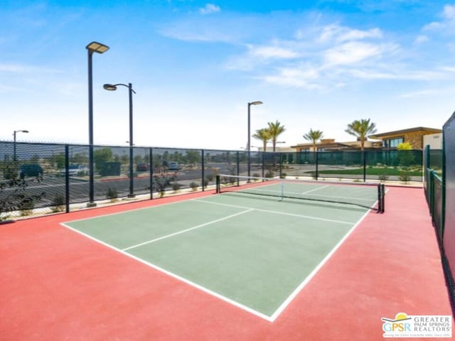 view of sport court with basketball hoop