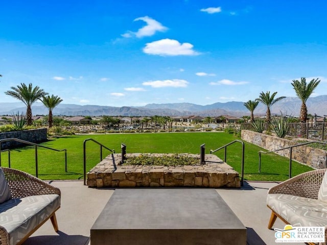 view of patio / terrace featuring a mountain view