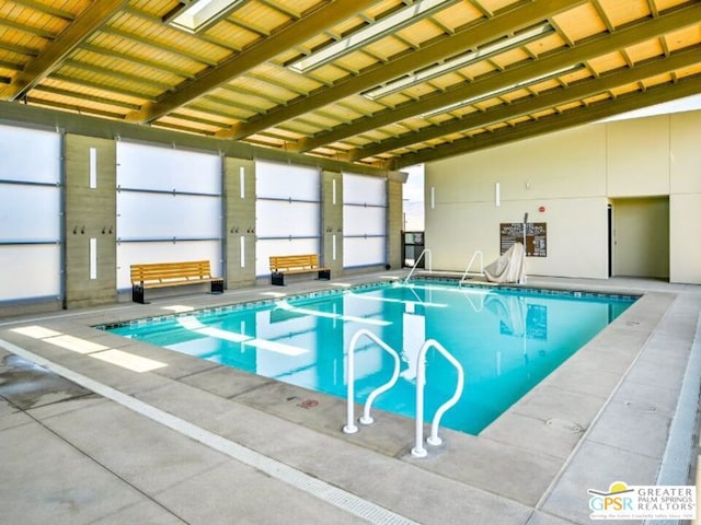 view of swimming pool with a skylight