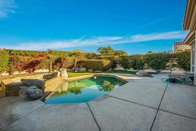 view of swimming pool with a patio area