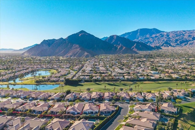 bird's eye view with a water and mountain view