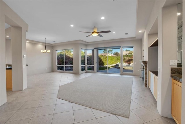 living room featuring crown molding, ceiling fan with notable chandelier, and light tile patterned flooring