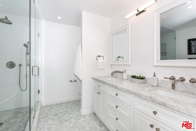 bathroom with an enclosed shower, vanity, and toilet