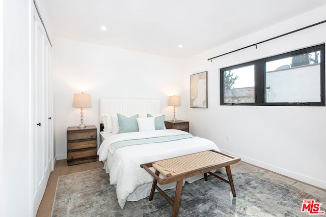 bedroom featuring wood-type flooring