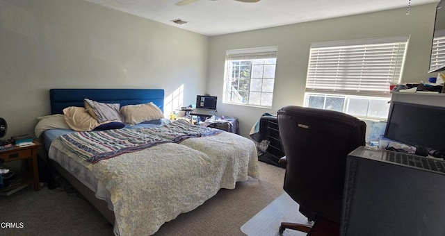 bedroom featuring ceiling fan and carpet floors