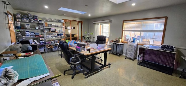 office space featuring a skylight