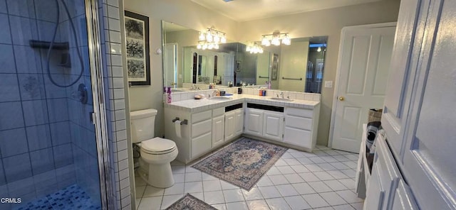 bathroom featuring walk in shower, vanity, tile patterned floors, and toilet