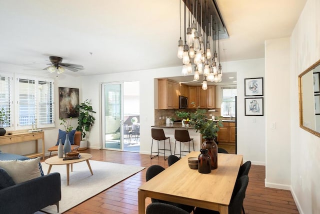 dining room featuring wood-type flooring and ceiling fan