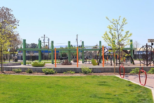 view of playground with a lawn