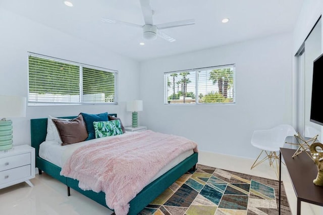 bedroom featuring ceiling fan and a closet