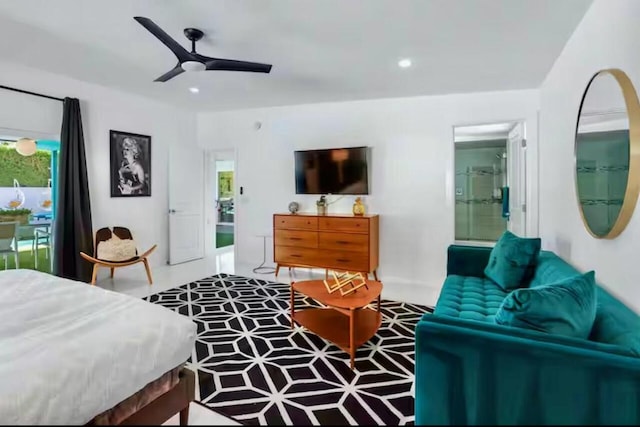 bedroom featuring ceiling fan and connected bathroom