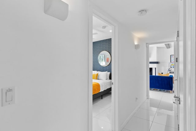 corridor with light tile patterned flooring