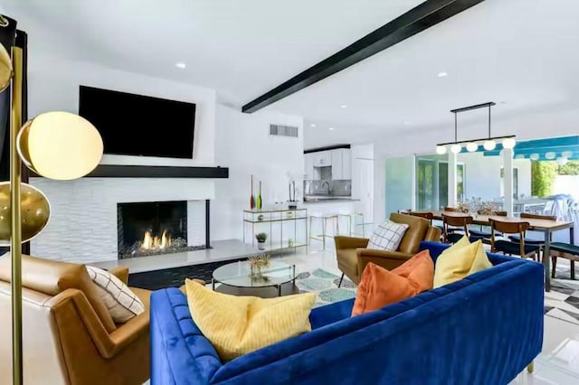 living room featuring beam ceiling