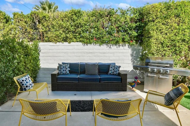 view of patio / terrace with outdoor lounge area and a grill