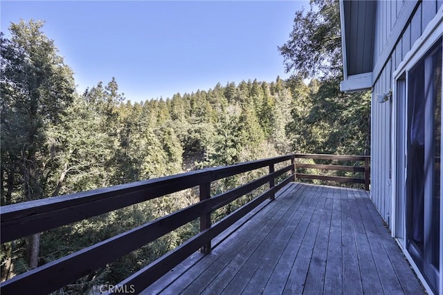 deck with a wooded view
