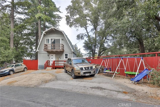 view of front of property featuring a playground