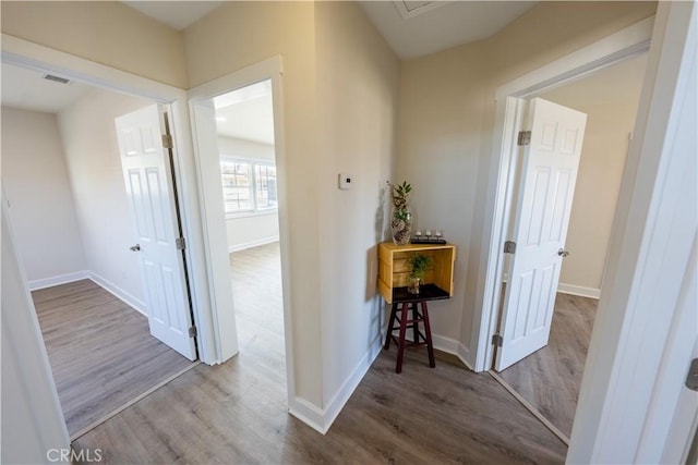 hallway featuring wood-type flooring