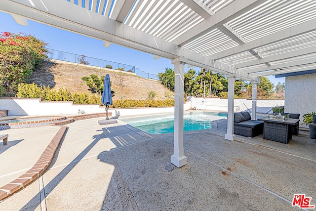 view of pool with an outdoor hangout area, a pergola, and a patio area