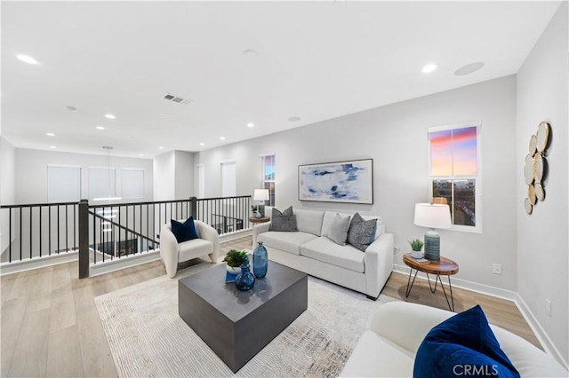 living room with light hardwood / wood-style flooring