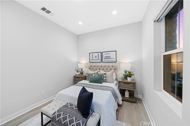 bedroom with light hardwood / wood-style flooring