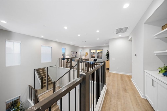 corridor with light hardwood / wood-style flooring