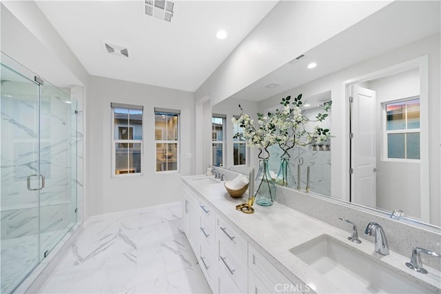 bathroom featuring walk in shower and vanity