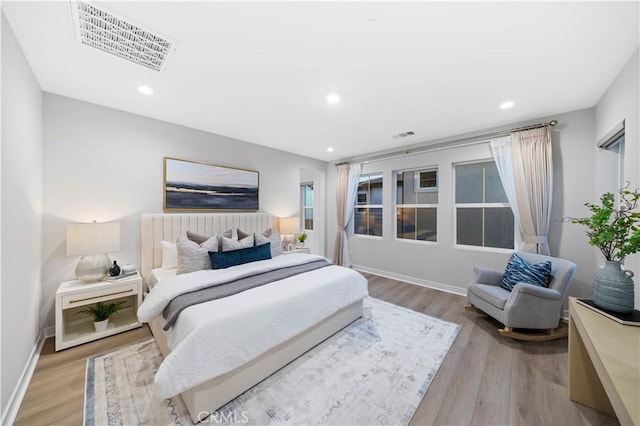 bedroom with light hardwood / wood-style flooring