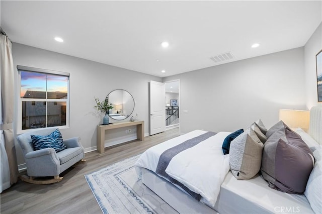 bedroom with light wood-type flooring