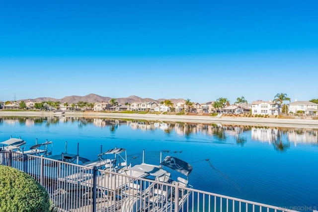 dock area featuring a water and mountain view