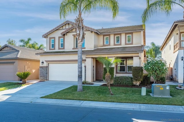 view of front of property featuring a front lawn and a garage