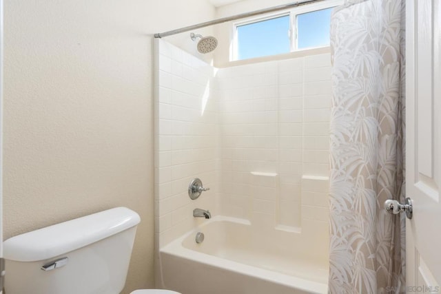 bathroom with toilet and shower / bathtub combination with curtain