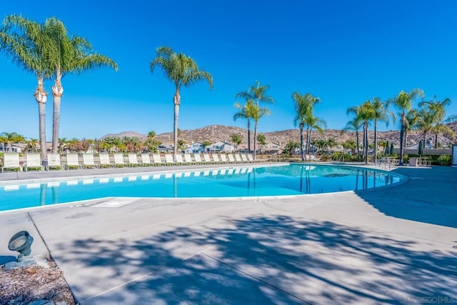 view of swimming pool featuring a mountain view