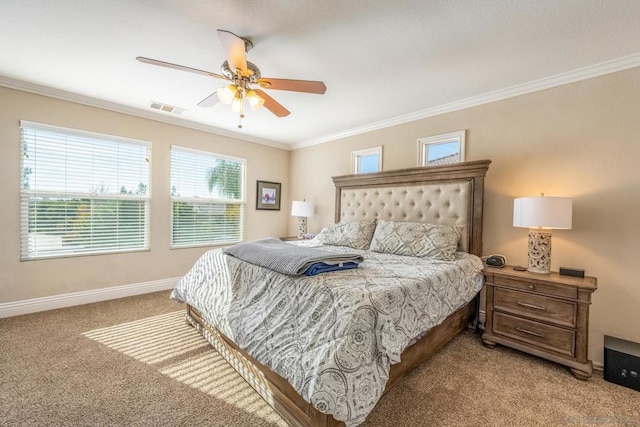 carpeted bedroom with ceiling fan, crown molding, and multiple windows