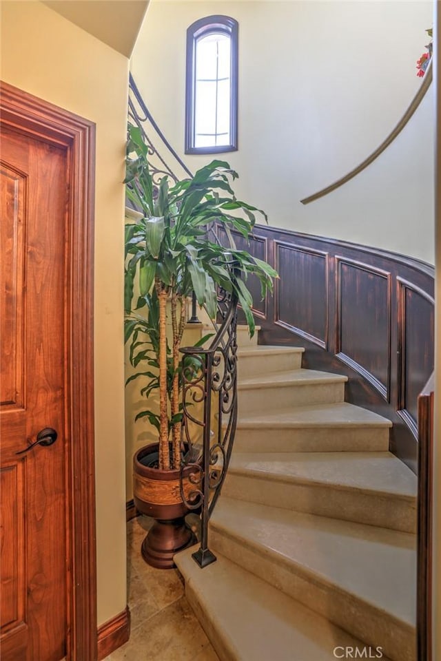 stairs with tile patterned flooring