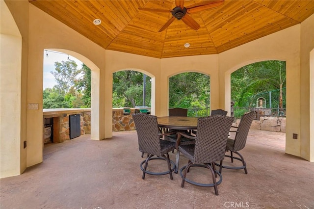 view of patio with ceiling fan and a gazebo