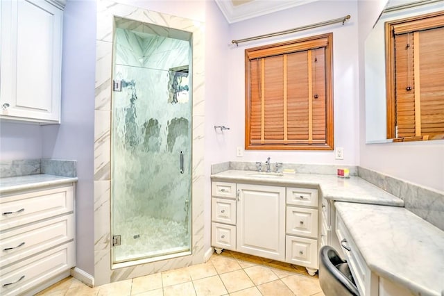 bathroom with tile patterned floors, crown molding, walk in shower, and vanity