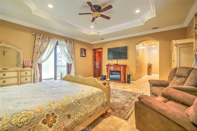 bedroom featuring ceiling fan, a raised ceiling, access to outside, light tile patterned flooring, and crown molding