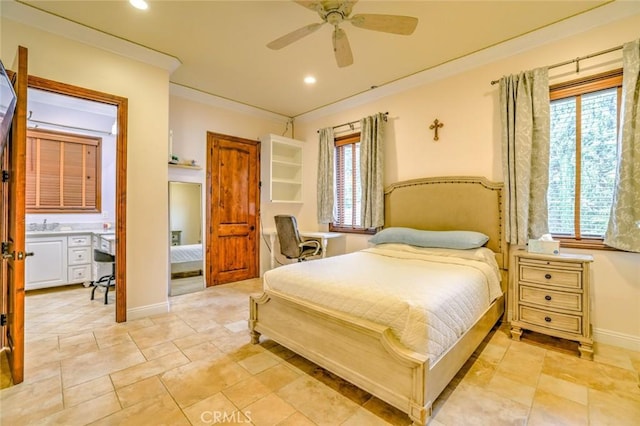 bedroom featuring ceiling fan, ensuite bath, and ornamental molding