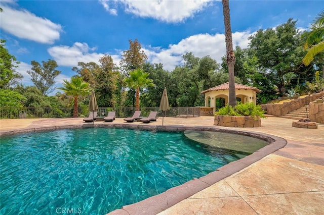 view of swimming pool with fence, a patio, and a fenced in pool