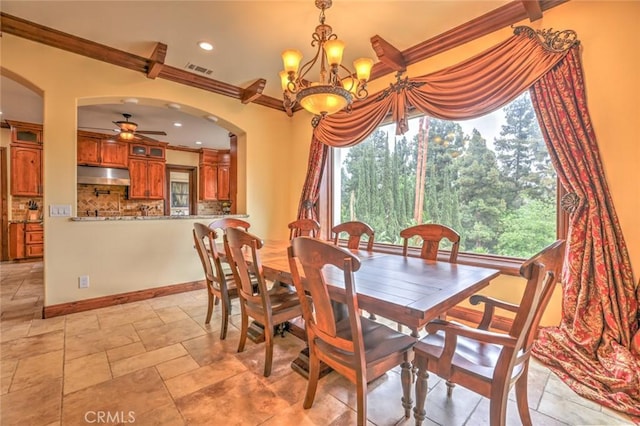 dining room featuring ceiling fan with notable chandelier, plenty of natural light, and ornamental molding